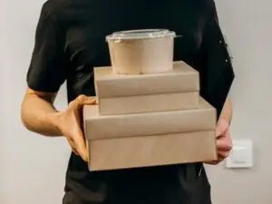 A Delivery Man Holding Boxes for Delivery